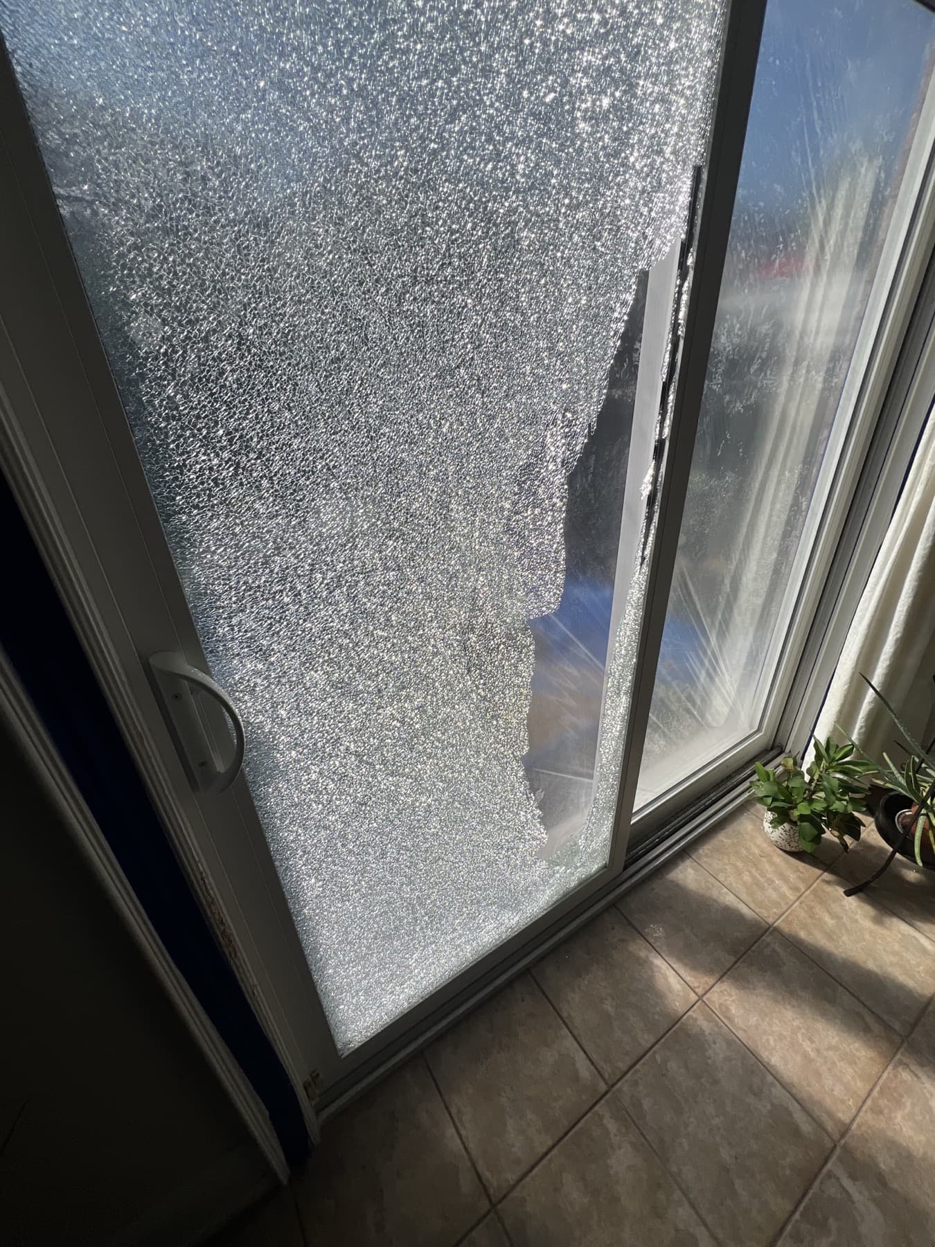 Shattered patio door glass before replacement