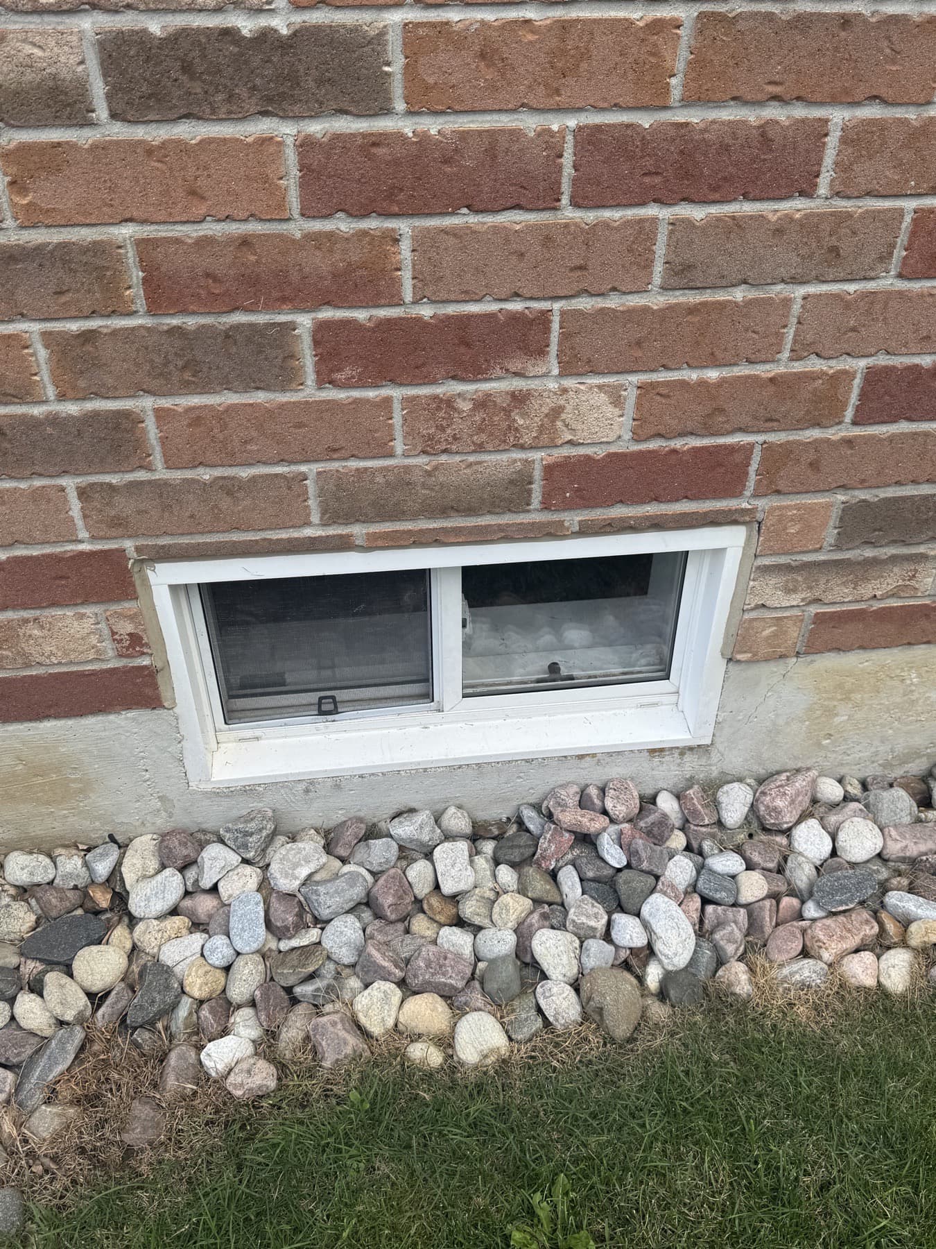 Basement window with the replacement glass installed
