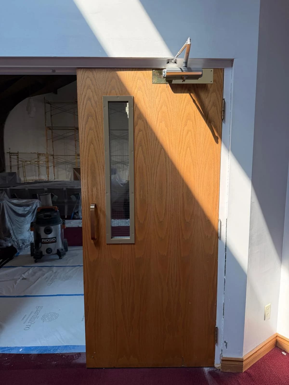 Commercial door with overhead closer and vision panel